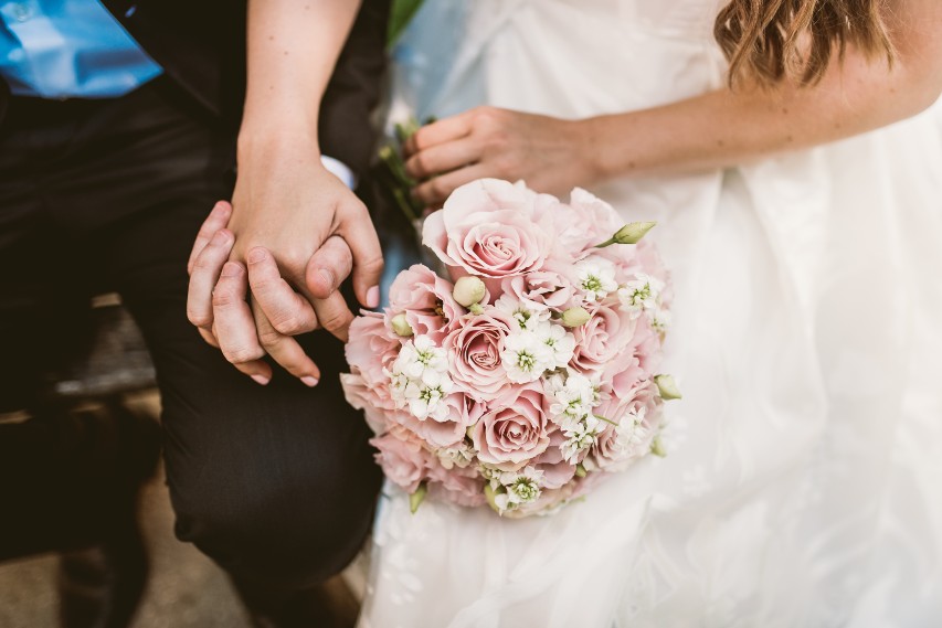 Bride And Groom Holding Hands
